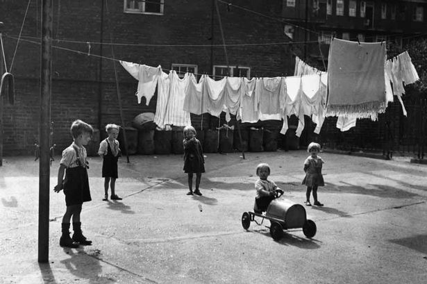 Young-children-playing-in-a-yard